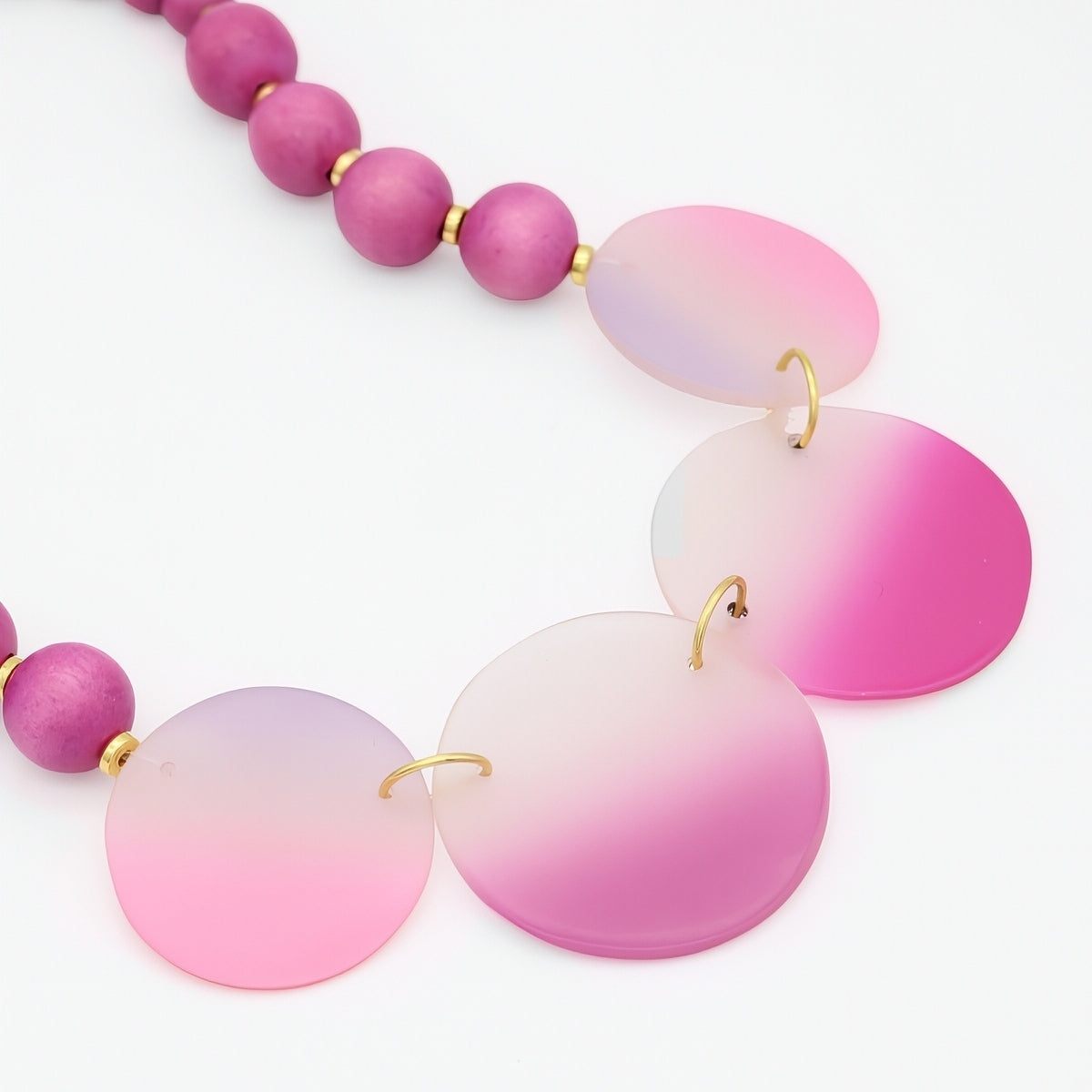 Necklace with pink and purple gradient beads on a white background