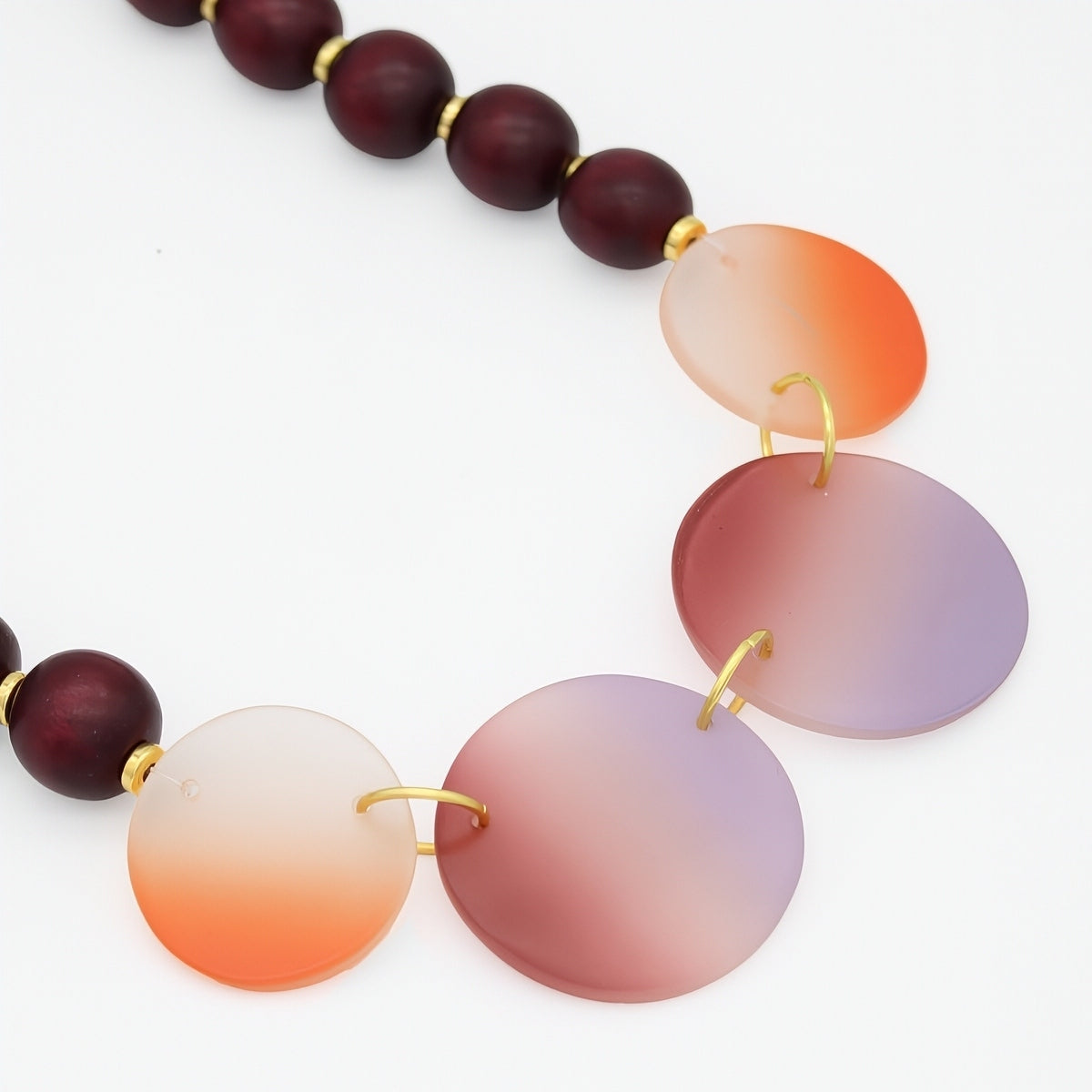 Necklace with gradient beads on a white background