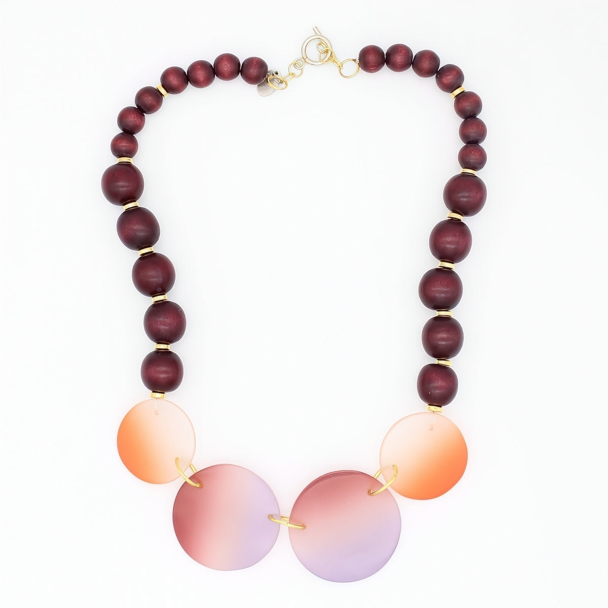 Necklace with wooden and gradient beads on a white background