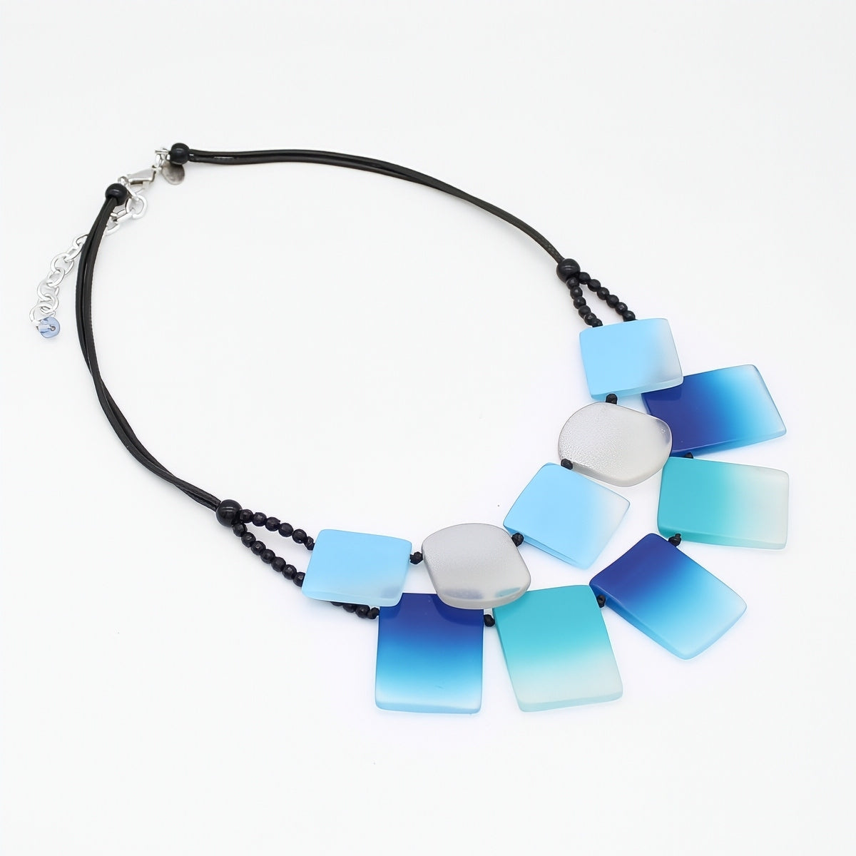 Necklace with blue and white gradient pendant on a white background