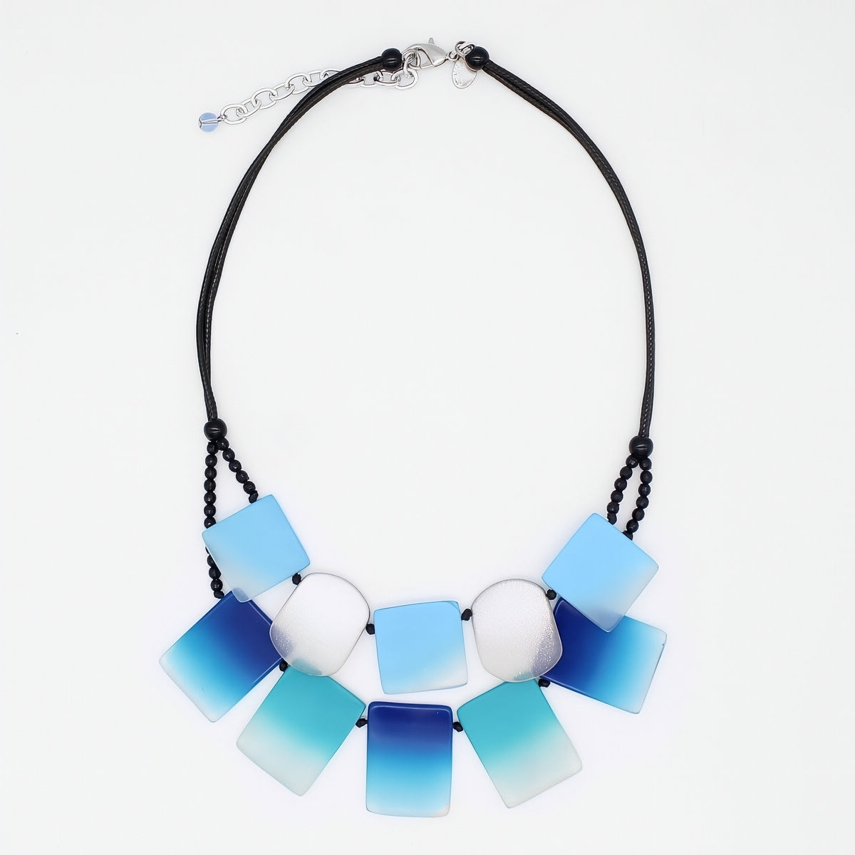 Necklace with blue and white square pendants on a white background