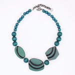 Teal resin and wood geometric statement necklace with round beads, striped resin pieces and extender chain