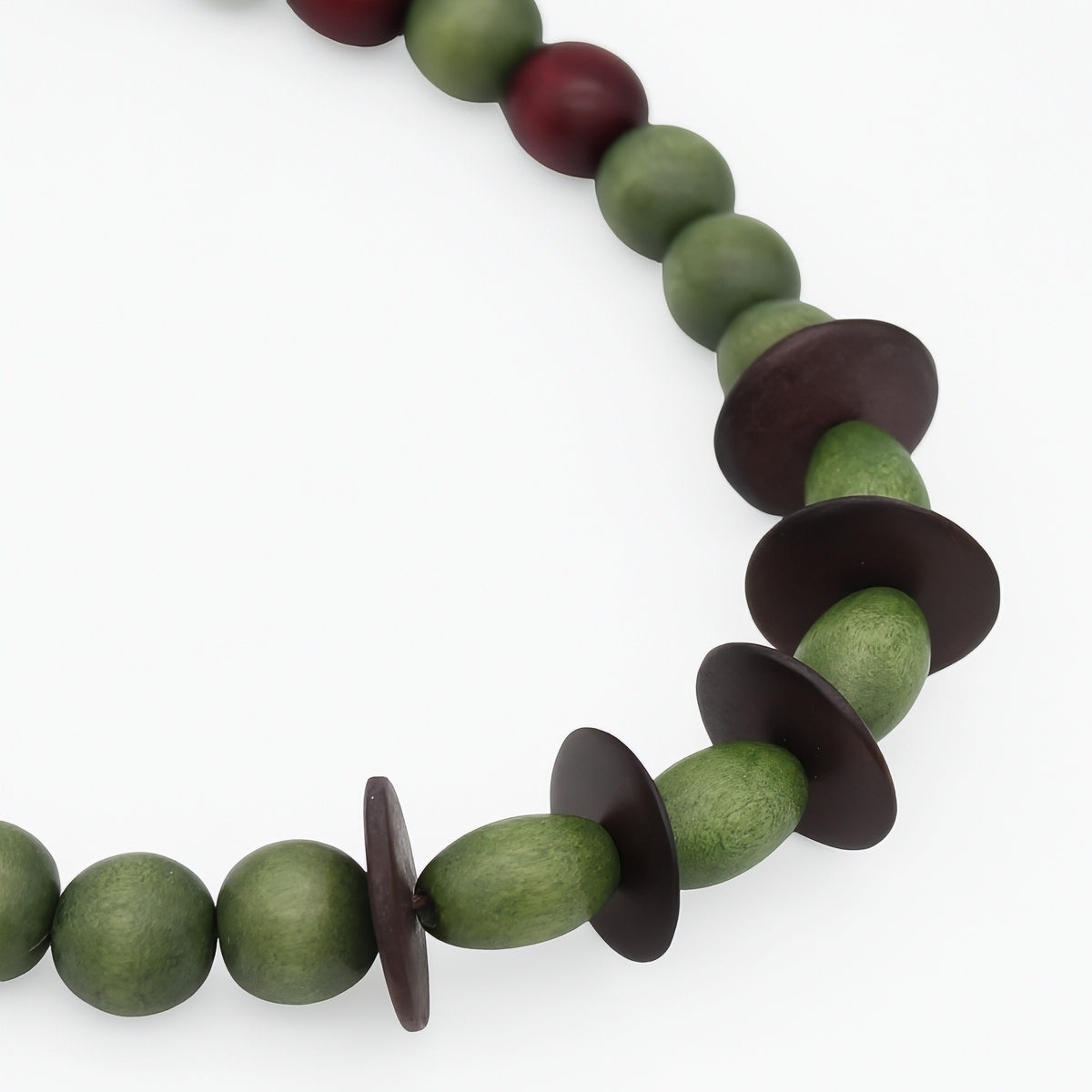 Close up detail of olive green and dark brown wood beads