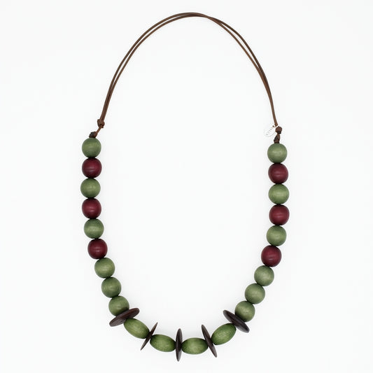 Olive green and burgundy wood statement necklace on white background