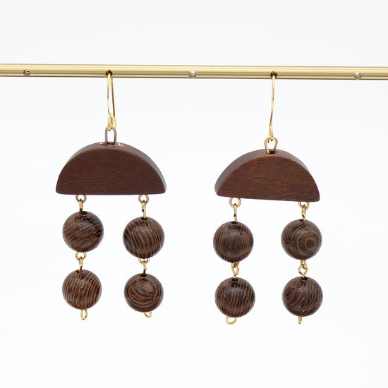Brown wood statement earrings with dangling round wood beads