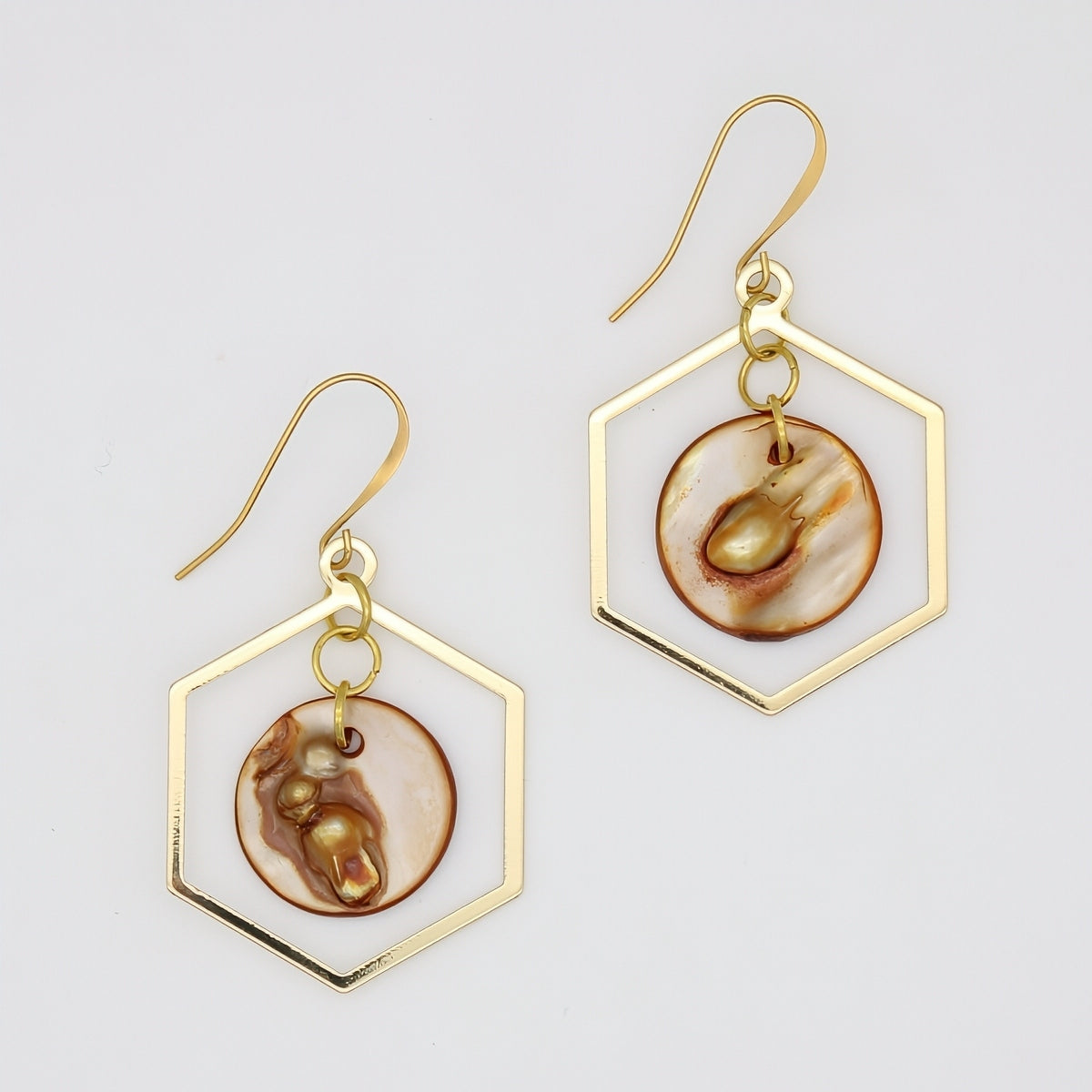 Gold hexagon statement earrings with round resin accents