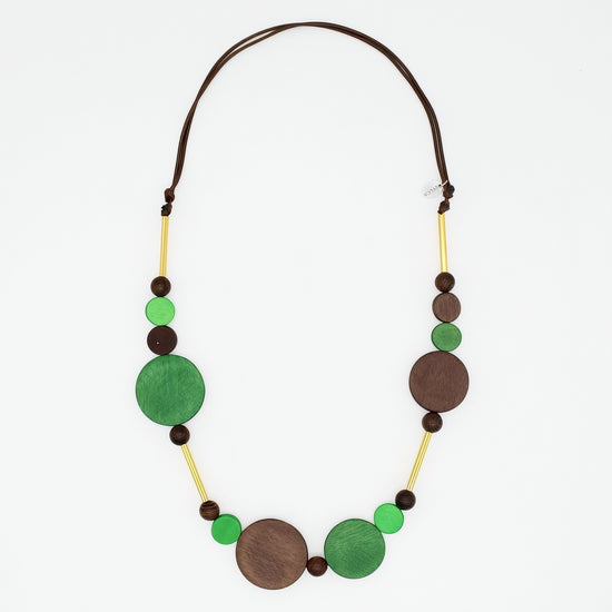 Green and brown wood circle statement necklace with gold accents on white background