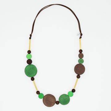 Green and brown wood circle statement necklace with gold accents on white background