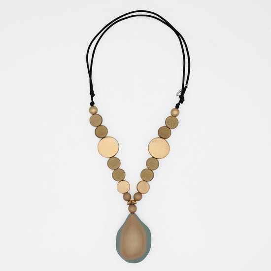 Taupe and gold wood statement necklace with layered resin pendant on white background
