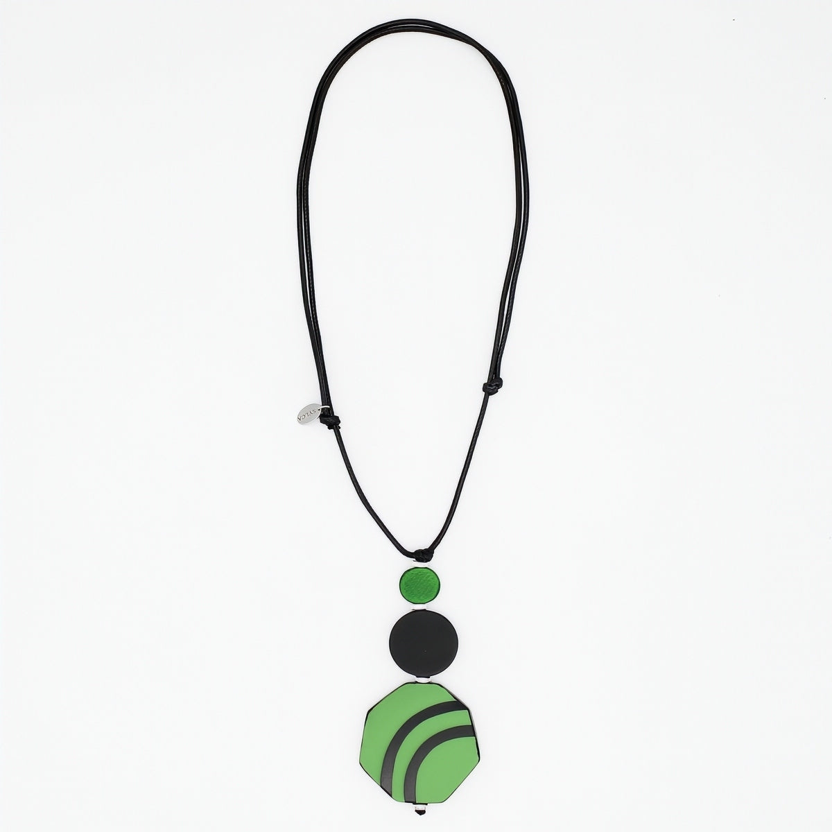 Green and black resin and wood pendant necklace on white background
