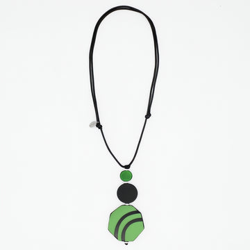 Green and black resin and wood pendant necklace on white background