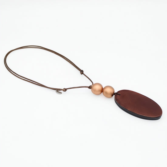 Brown resin pendant necklace angled product view