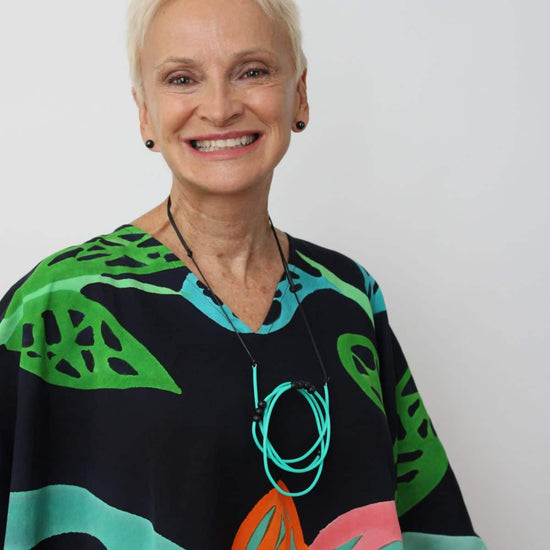 woman wearing aqua tubbing necklace